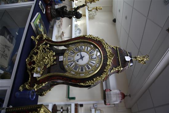 A 19th century French Louis XVI style ormolu and red boulle bracket clock, clock 41.5in. with matching wall bracket (14in.)